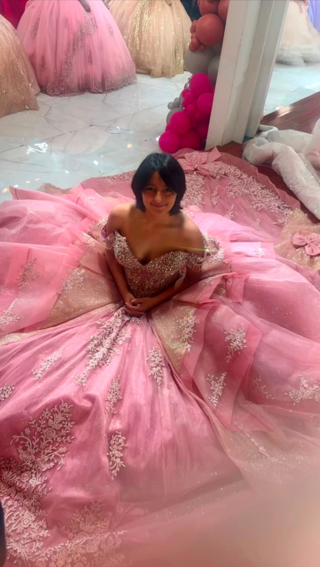 Yvanna seated in a ballgown
